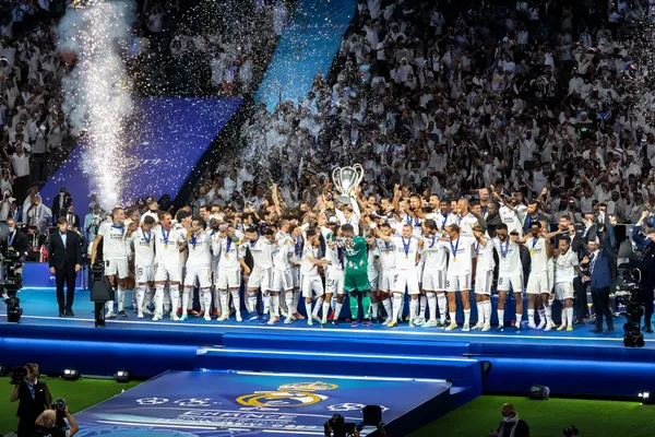 REAL MADRID Games - Enjoy nonstop entertainment A close-up shot of golden coins falling around a spinning roulette wheel, representing immersive casino action at REAL MADRID.
