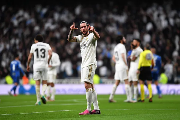 A person using their device against a moody casino-themed background, illustrating the smooth re-entry process at REAL MADRID.